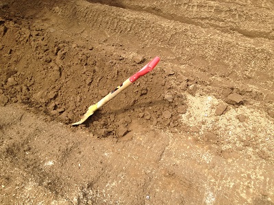 Farm beds using shovel to build bed